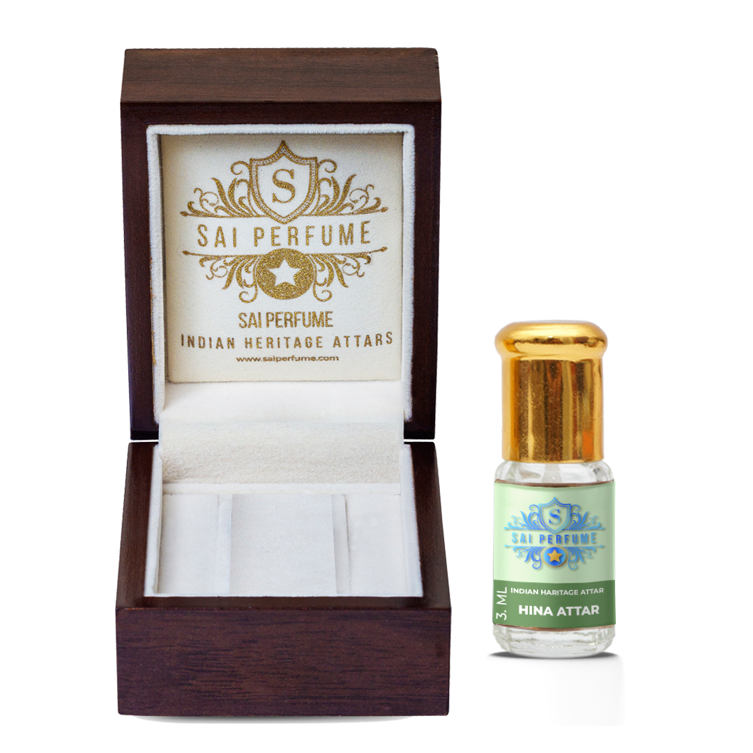 Applying alcohol-free Gul Henna Attar perfume oil to the skin, highlighting its rich, sweet floral and warm spicy natural fragrance notes.