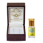 An artisan fragrance creator blending delicate, powdery Mimosa Absolute into an elegant vintage-inspired natural perfume.