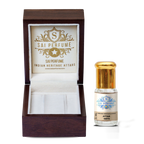 Applying natural Mitti Attar petrichor perfume oil to the wrist, highlighting the vegan, alcohol-free, and earthy formula.