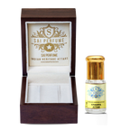 Applying natural Champa Attar perfume oil to the wrist, highlighting the rich, floral, and alcohol-free Champaca fragrance.