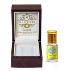An artisan fragrance blender incorporating vivid green Marigold Absolute Oil into a bespoke, herbaceous natural perfume on a rustic workspace.