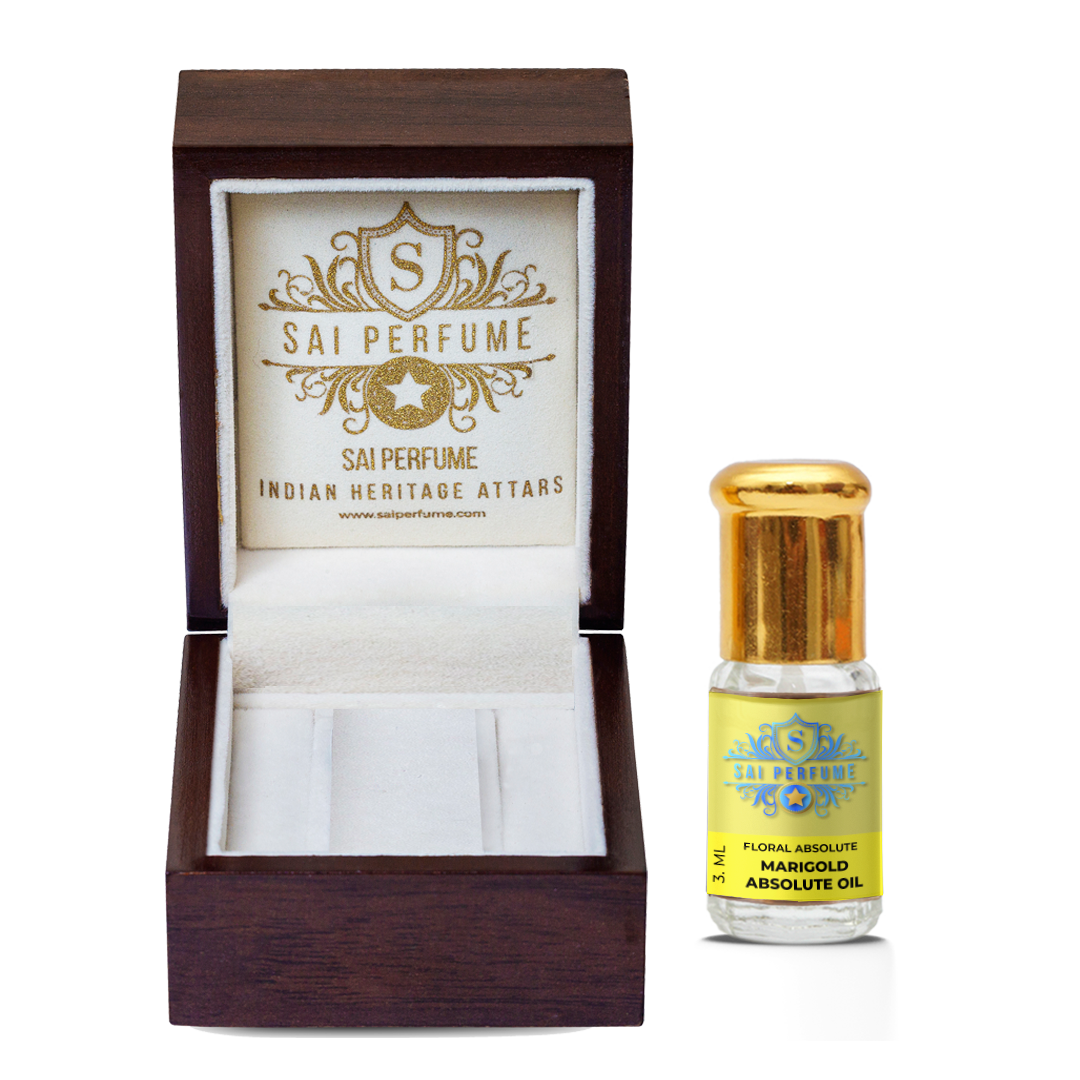 An artisan fragrance blender incorporating vivid green Marigold Absolute Oil into a bespoke, herbaceous natural perfume on a rustic workspace.