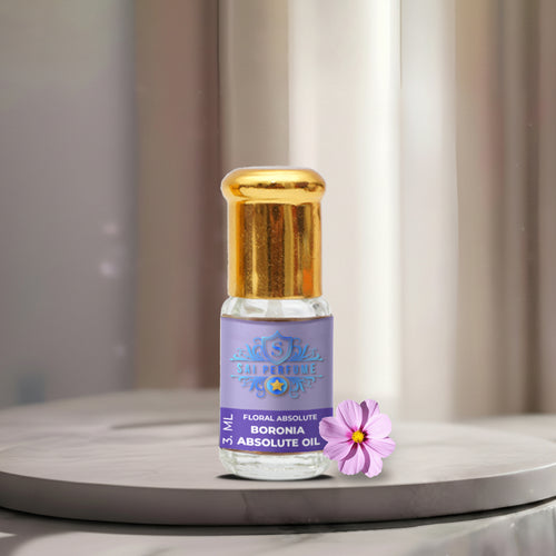 A luxury glass bottle of 100% Pure Boronia Absolute Oil by Sai Perfume, showcasing the extremely rare, dark green, violet-scented floral extract.