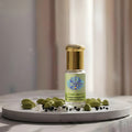 Premium glass bottle of pure Cardamom Extra Absolute Oil by Sai Perfume, showcasing rich, natural botanical extract for luxury perfumery and aromatherapy.