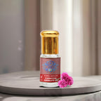 A premium glass bottle of pure Carnation Absolute Oil by Sai Perfume, showcasing the rich, golden-brown floral extract used in luxury perfumery.