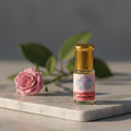 Bottle of pure Gulab Attar, a 100 percent natural and alcohol-free Indian Rose perfume oil by Sai Perfume.