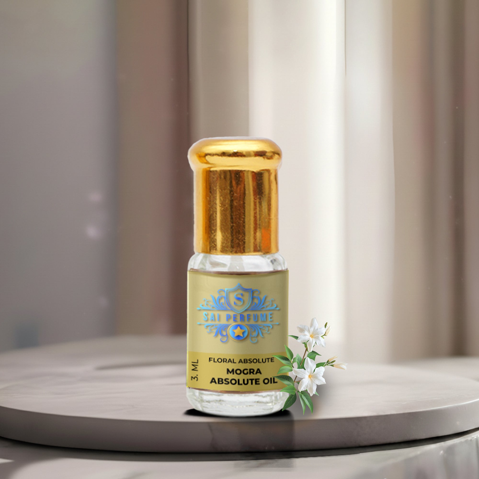 A premium glass vial of pure Mogra Absolute Oil by Sai Perfume, surrounded by freshly handpicked, tightly curled white Jasmine Sambac blossoms.