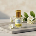 Bottle of pure Mogra Attar, a 100 percent natural and alcohol-free Sambac Jasmine oil perfume by Sai Perfume.