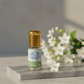 Bottle of pure Motia Attar, a 100 percent natural and alcohol-free Pearl Jasmine oil perfume by Sai Perfume.