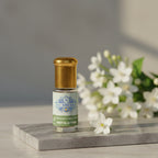 Bottle of pure Motia Attar, a 100 percent natural and alcohol-free Pearl Jasmine oil perfume by Sai Perfume.