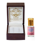 A holistic wellness practitioner crafting a divine, spiritually grounding fragrance blend using rich, honeyed Pink Lotus Absolute Oil for a meditation ritual.